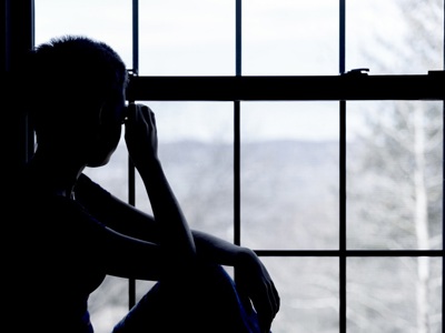 Teen Looking Out Of Window