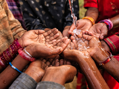 cupped hands overflowing with water (1)