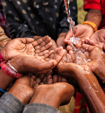 cupped hands overflowing with water (1)