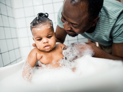 Father Washing Baby
