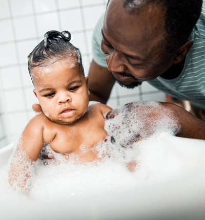 Father Washing Baby