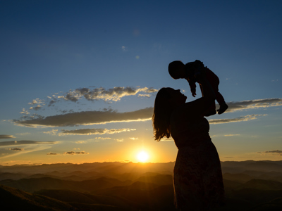 mother holding baby