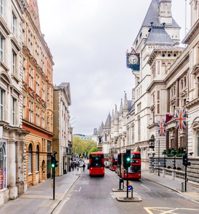 Fleet Street in London with red double decker buses
