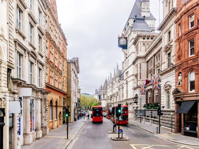 Fleet Street in London with red double decker buses