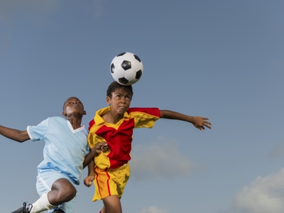 Young Players Heading The Ball