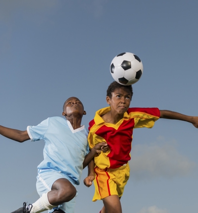 Young Players Heading The Ball