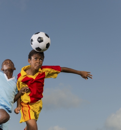 Young Players Heading The Ball