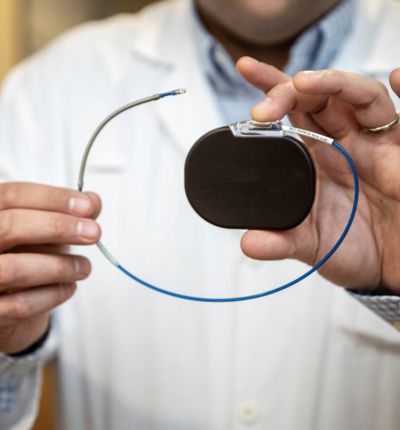 Man Holding Pacemaker