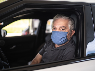 driver senior wearing protective medical mask