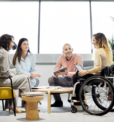 Young Female Wheelchair User In Group