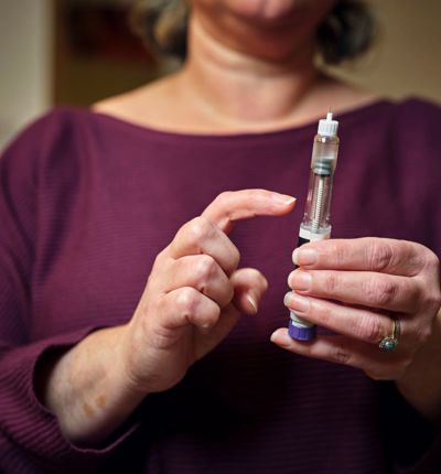 Woman using weight loss injection