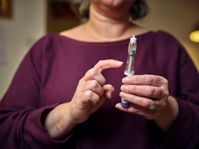 Woman using weight loss injection