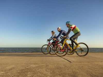 Image of 3 people riding a bike