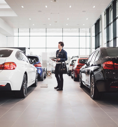 Someone in a car showroom