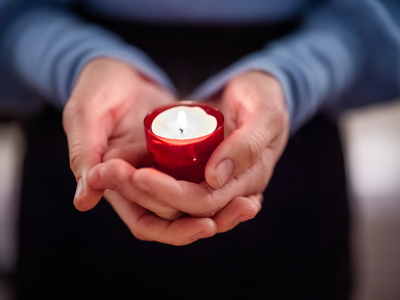 Woman Holding A Candle