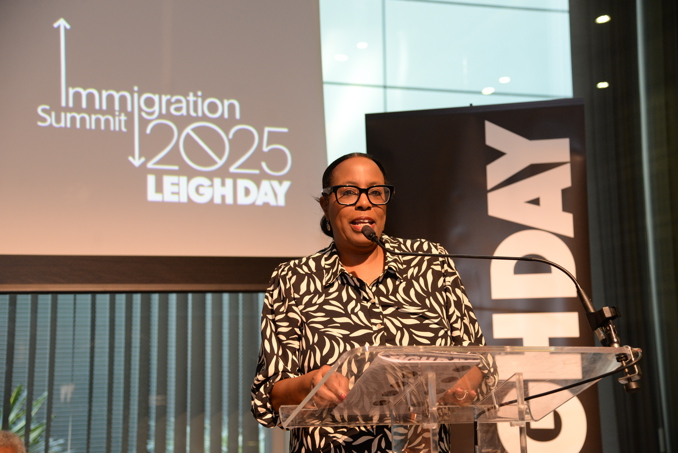 Jacqueline McKenzie speaking at a podium