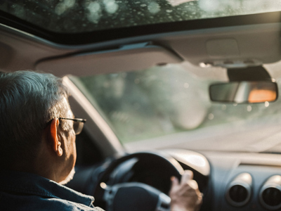 Middle aged man driving