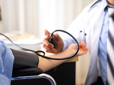 GP Taking Blood Pressure Reading