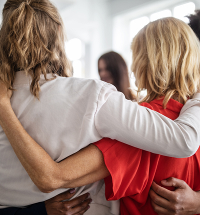 Creative business professionals huddling