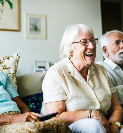 Four elderly people sat in a row