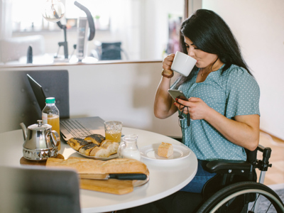women in wheelchair working from home