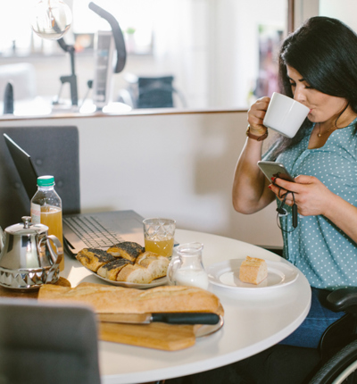 women in wheelchair working from home