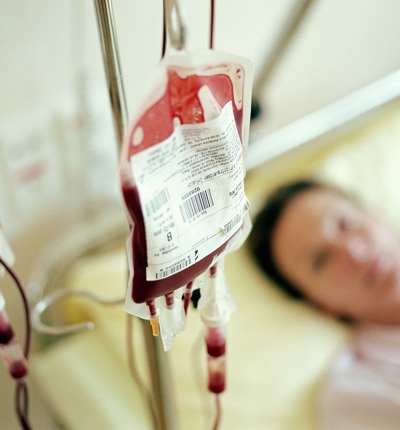 Blood bag, woman in hospital bed