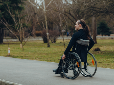 Woman Affected By Spinal Cord Injury In A Park