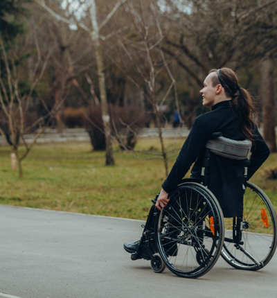 Woman Affected By Spinal Cord Injury In A Park