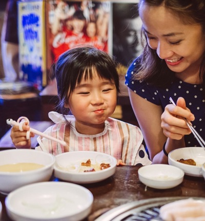 Family Eating In Restaurant